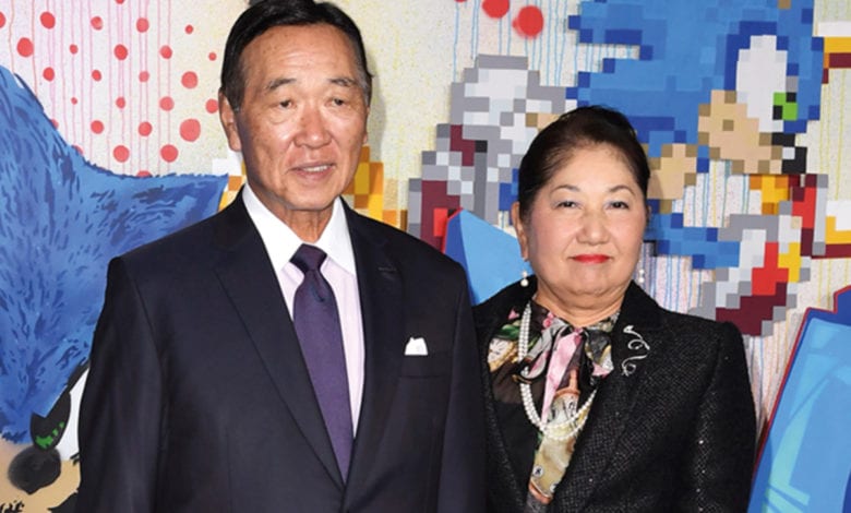 SEGA Sammy CEO with his wife
